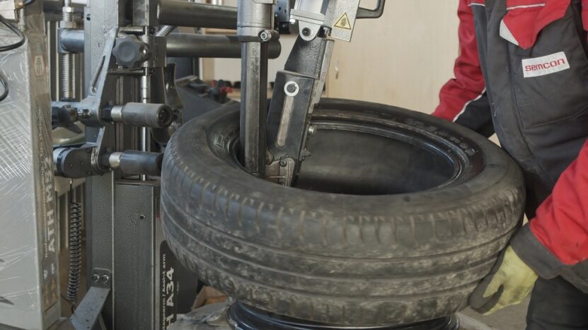 Repairing a damaged truck tire in a service shop