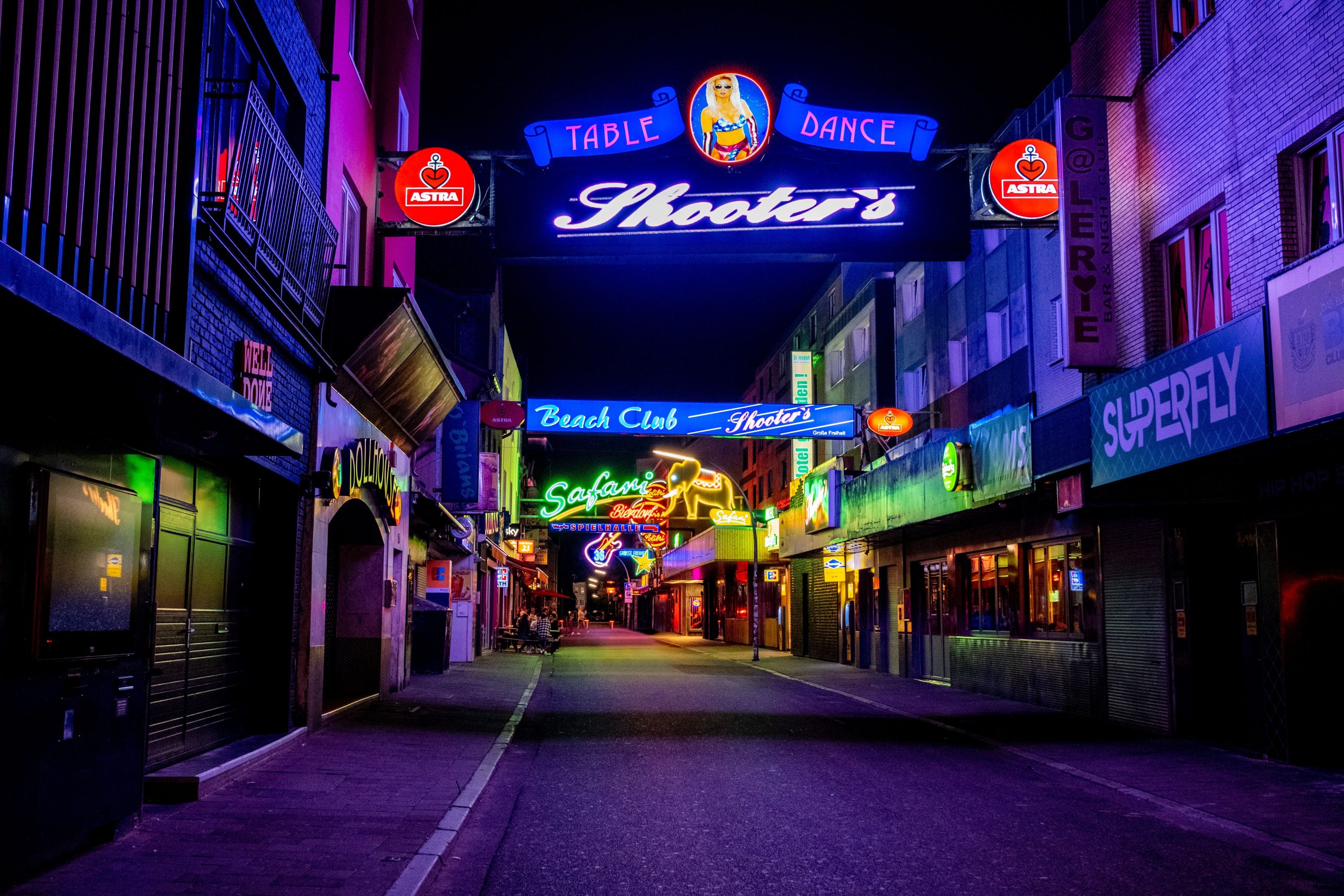 Neon-lit Reeperbahn street in Hamburg, a nightlife district associated with Germany's sex-work industry.